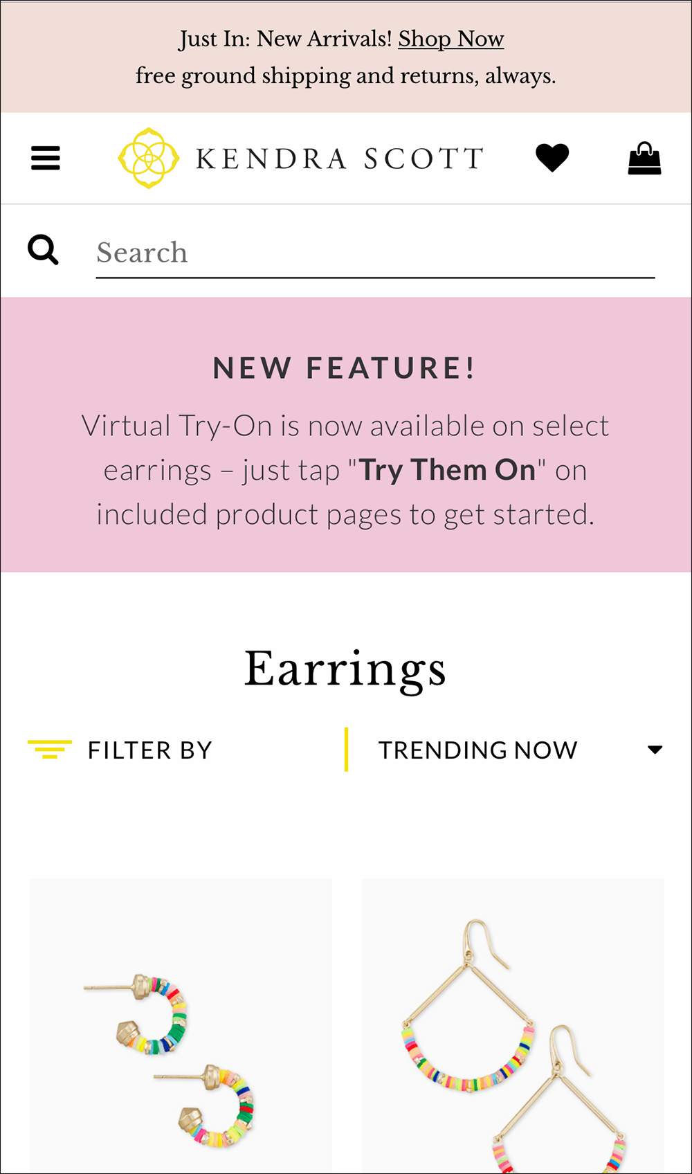 Screenshot showing a pink banner at the top of product listings stating "New Feature! Virtual Try-On is now available on select earrings — just tap Try Them On on included product pages to get started."