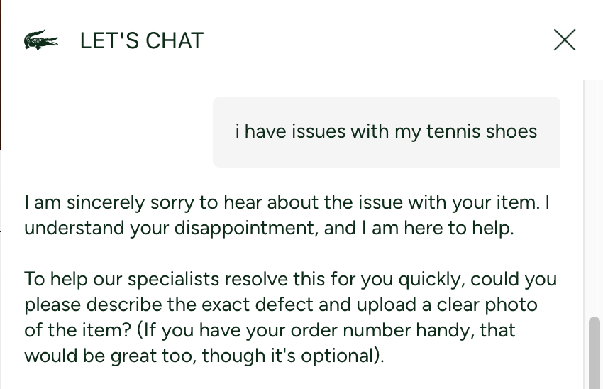 Lacoste "LET'S CHAT" window. The user writes "i have issues with my tennis shoes." The bot replies, "I am sincerely sorry to hear about the issue with your item. I understand your disappointment, and I am here to help," then asks for a description and photo of the defect — assigning the user an emotion (disappointment) they never stated.