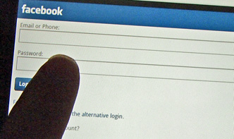 Photo of Kindle Fire screen as the user is touching a field on the Facebok login page.